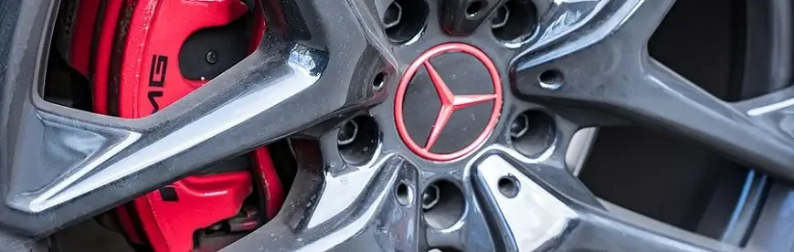 What You Should Know About Mercedes-Benz Maintenance | Heights Swedish Solutions in Cleveland Heights, OH. Closeup image of a Mercedes Benz car wheel and brakes.