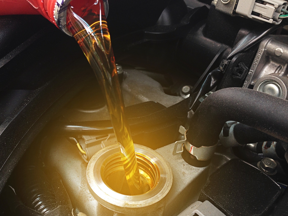 Synthetic vs. Conventional Oil: Making the Best Choice for Your European Car with Heights Swedish Solutions in Cleveland Heights, OH. Image of fresh oil being poured into a car engine.