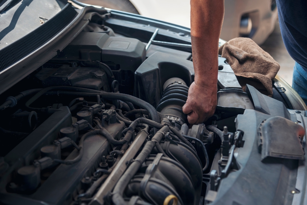 Back-to-School Car Maintenance in Cleveland Heights OH At Heights Swedish Solution. Auto mechanic inspecting car for maintenance.
